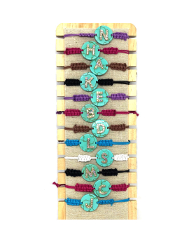 Rhinestone Initial on teal disk and assorted macrame bracelet